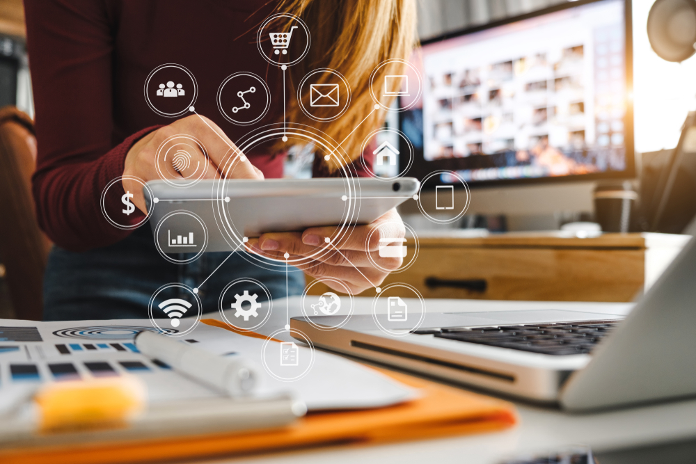 woman working on tablet using marketing technology